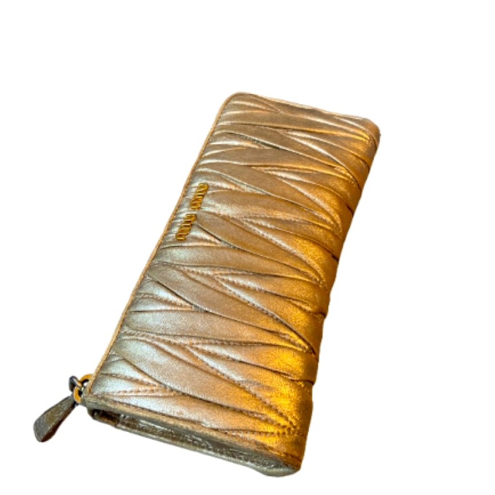 Miu Miu long metallic gold leather wallet with signs of wear Sold AS-IS